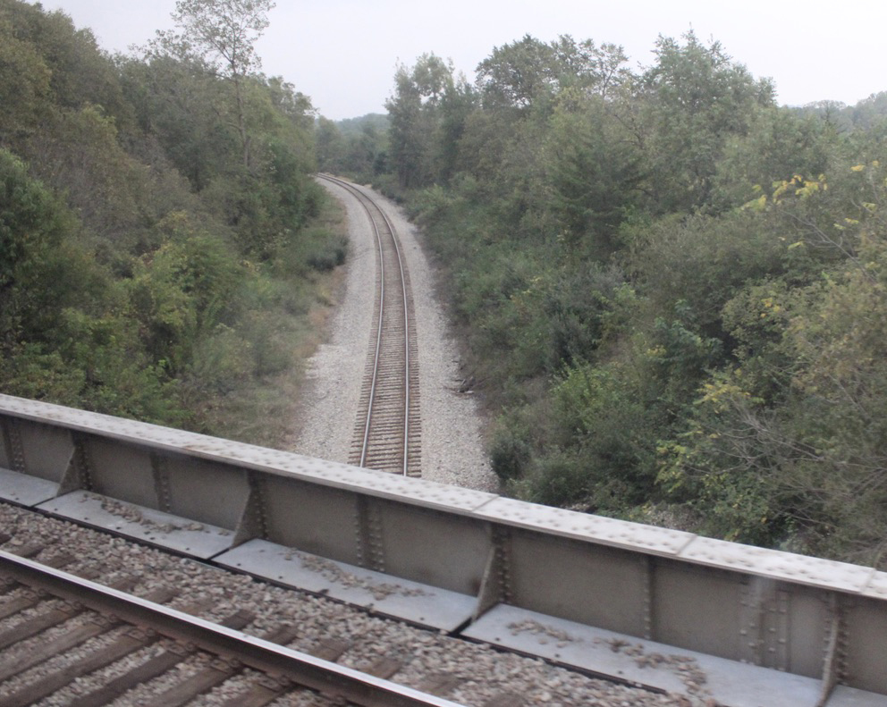 Railroad line as seen from another track crossing overhead
