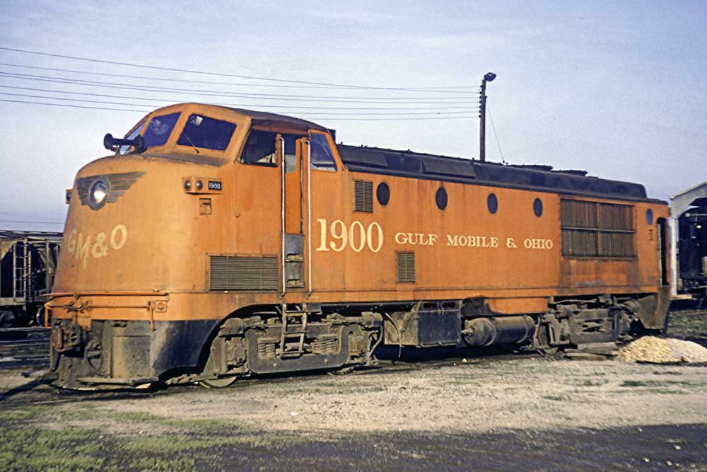 Red diesel locomotive with bulbous cab on roof