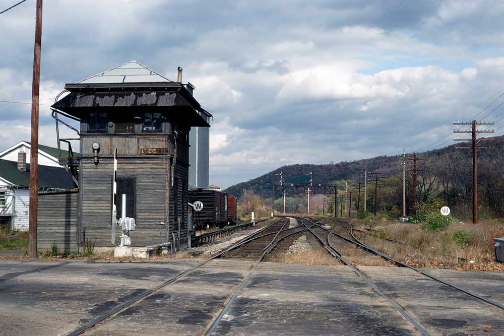 Wooden interlocking tower along two track rail line where railroad tower operator works