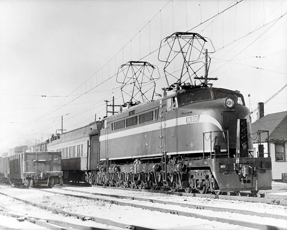 Streamlined, double-ended electric locomotive with passenger train