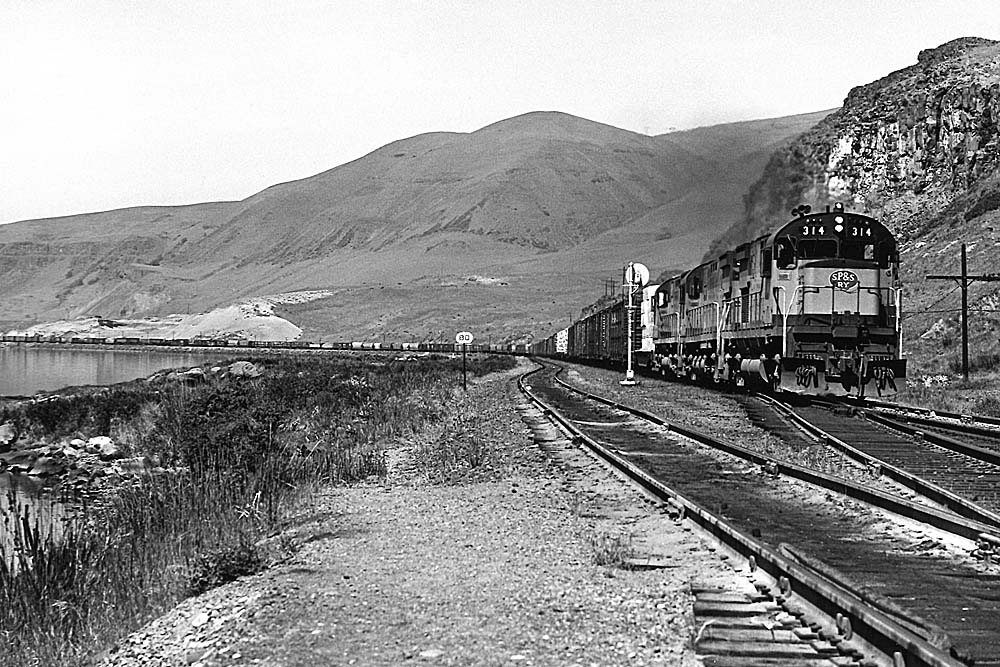 Diesel locomotives with freight train along river