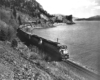 Diesel locomotives with freight train along river