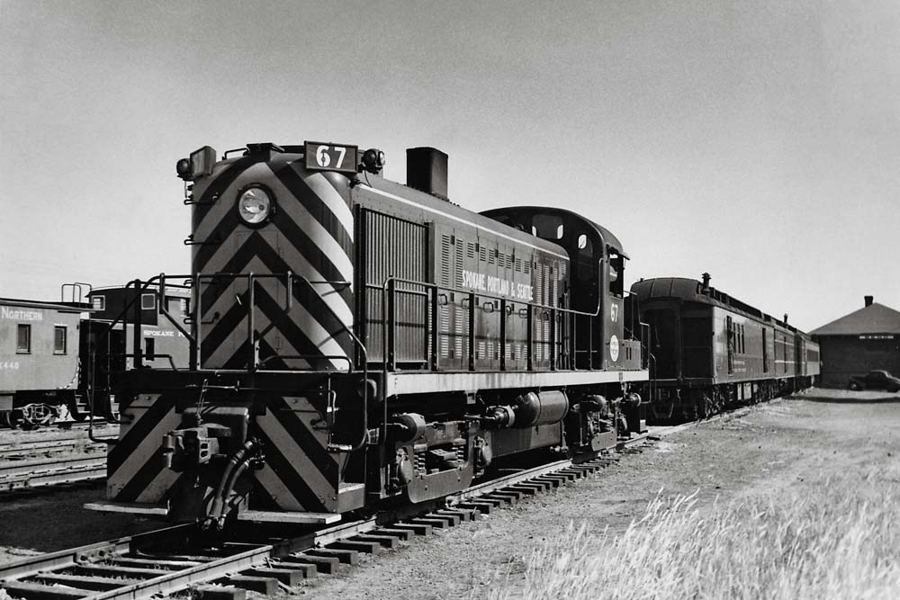 Diesel locomotives with passenger train by station