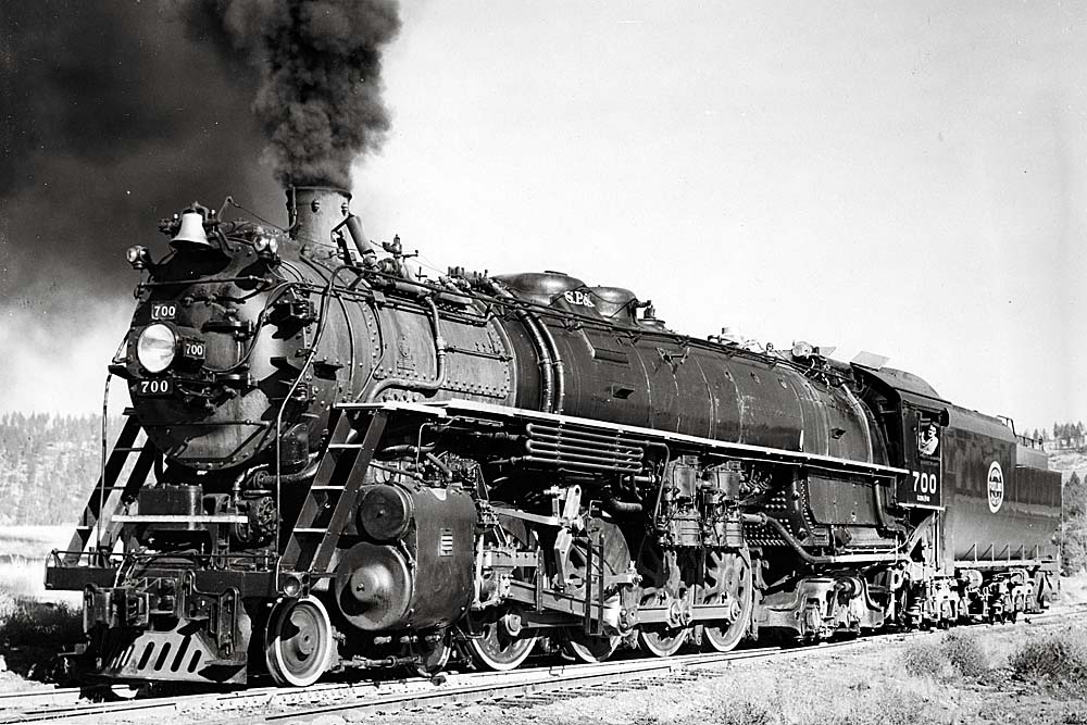 Steam locomotive smoking profusely