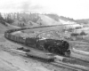 Steam locomotives with freight train along river