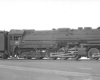 Long steam locomotive in profile