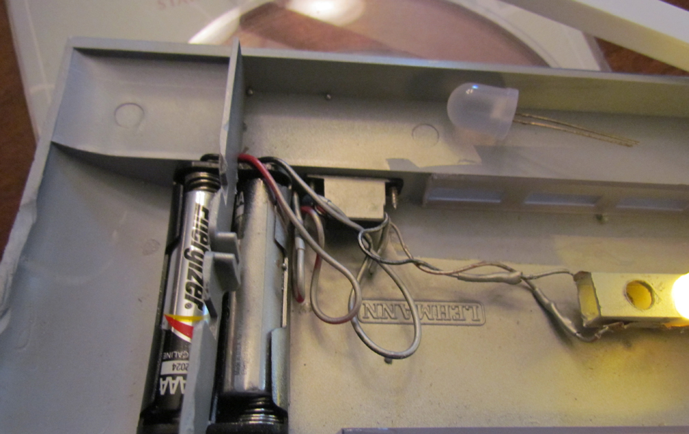 Battery pack and wires on an interior passenger car roof