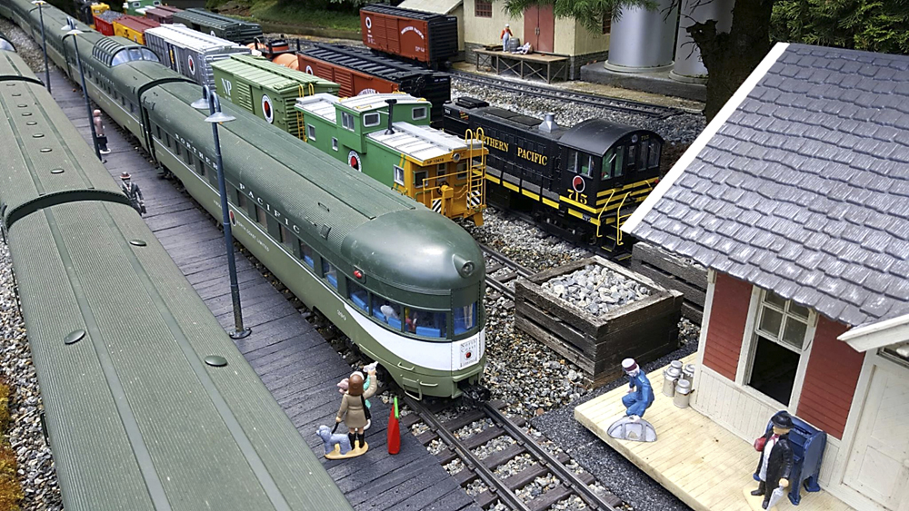 two model trains at a station