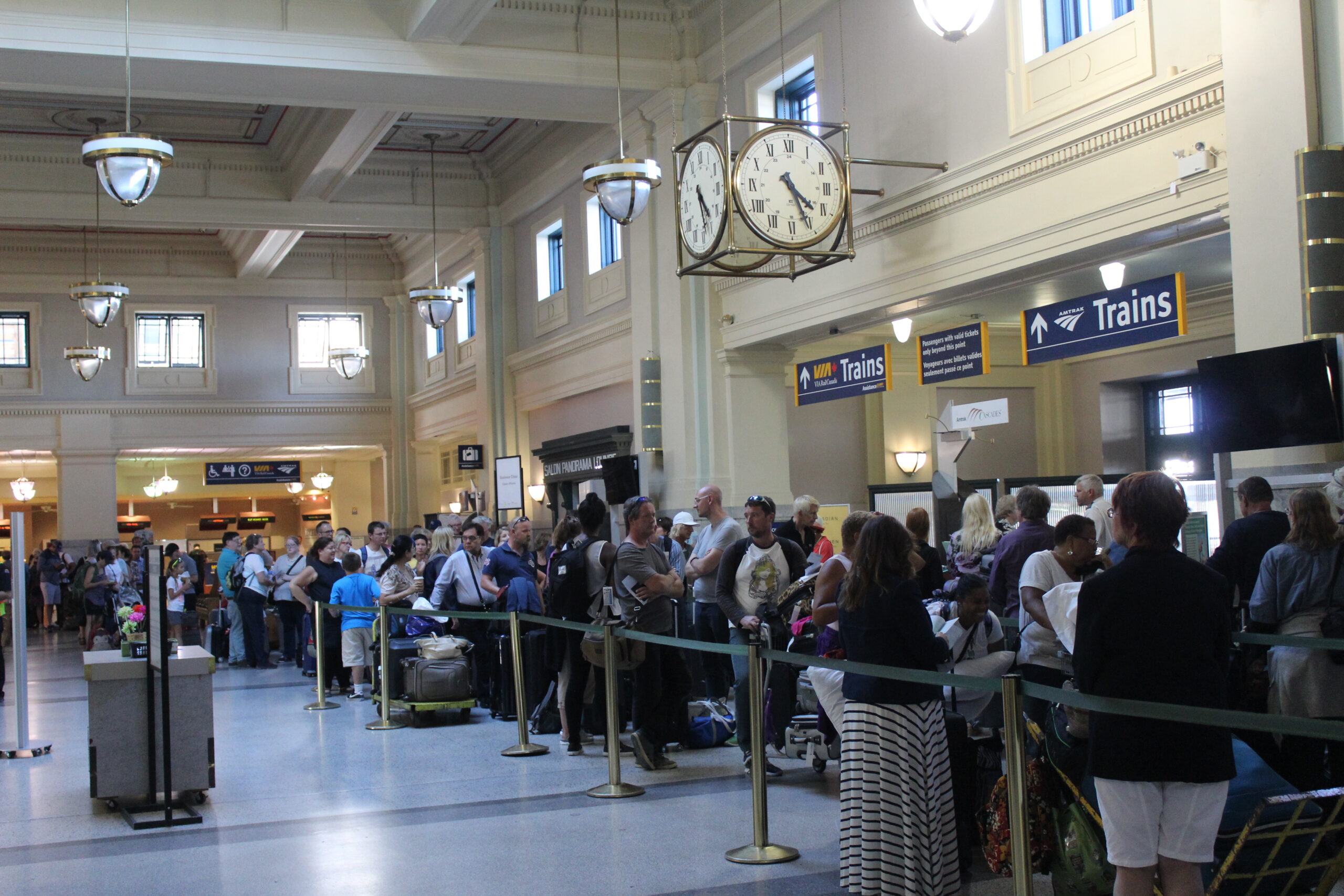Passengers waiting in line at a train station