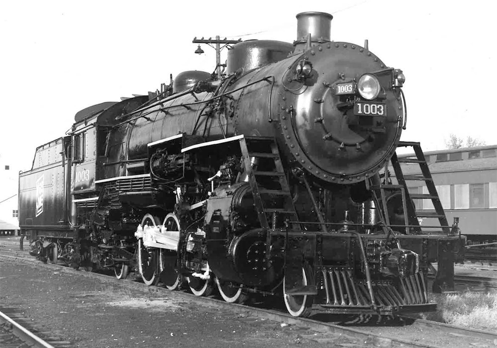 A black-and-white photo of a 2-8-2 Mikado steam locomotive seen in 3/4 angle
