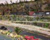 People fish in a pond while on the other side of a rail yard diesels wait for another train to pass