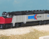 Photo of N scale locomotive and baggage car on scenicked base