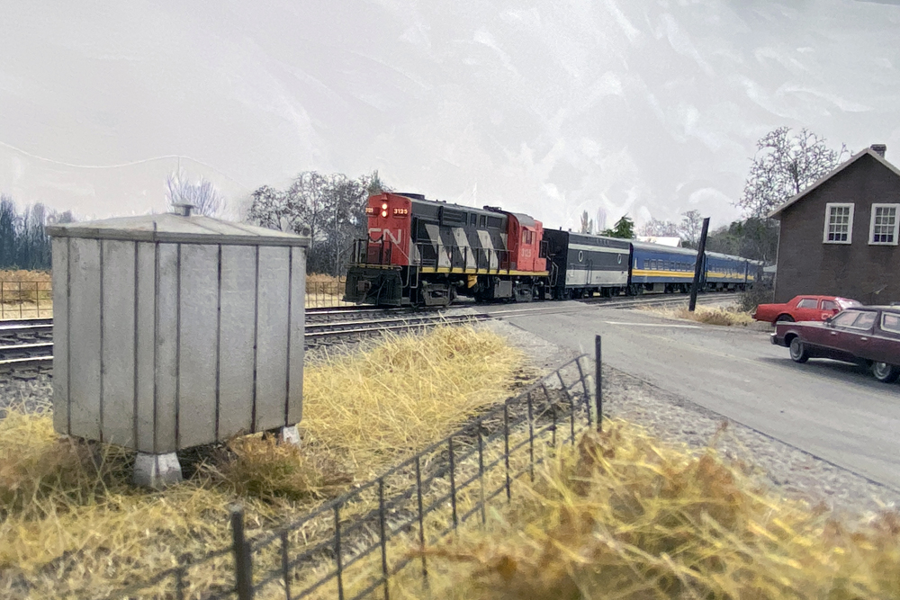 Canadian National locomotive pulling passenger cars on a layout