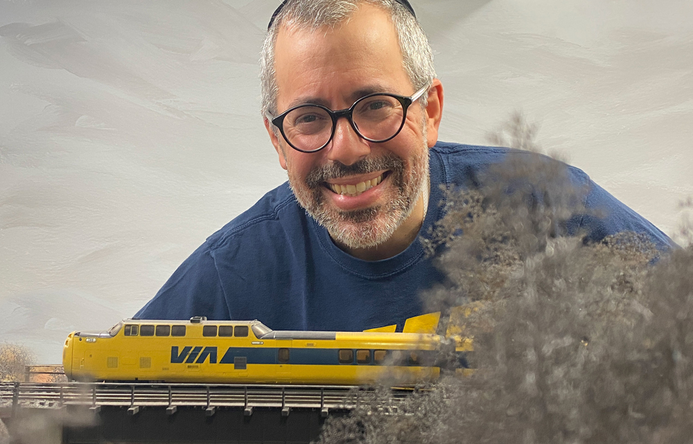 man smiling above a Turbo Train