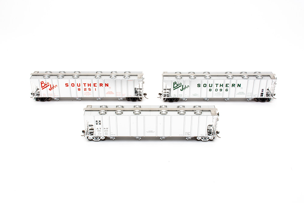 Three white train cars
