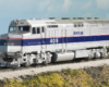 Photo of HO scale four-axle cowl-bodied diesel locomotive on scenicked base