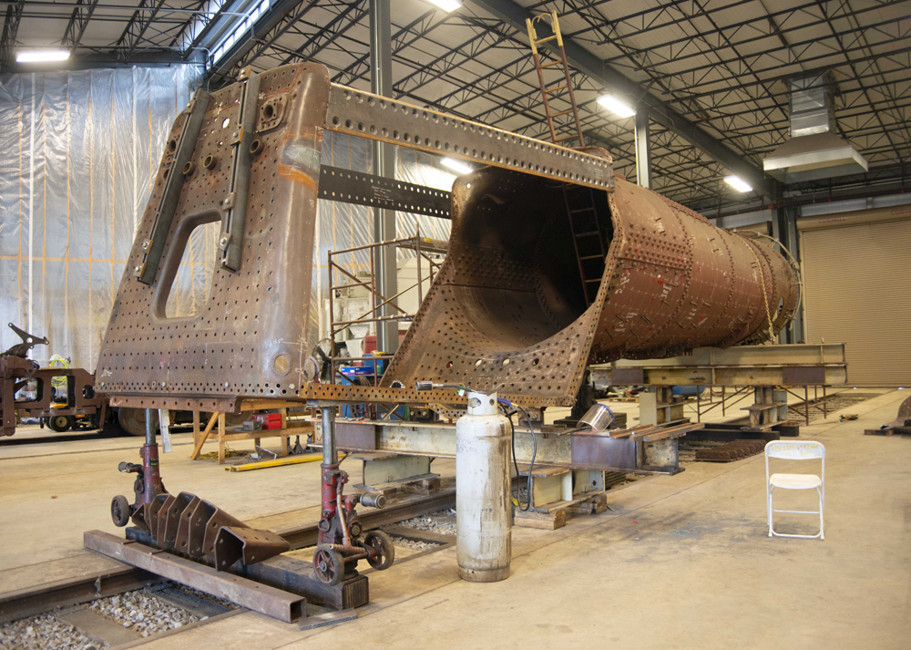 Disassembled locomotive in shop building