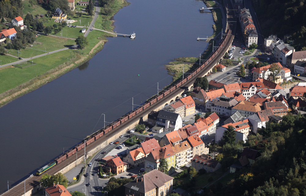 Aerial view of coal train running along river