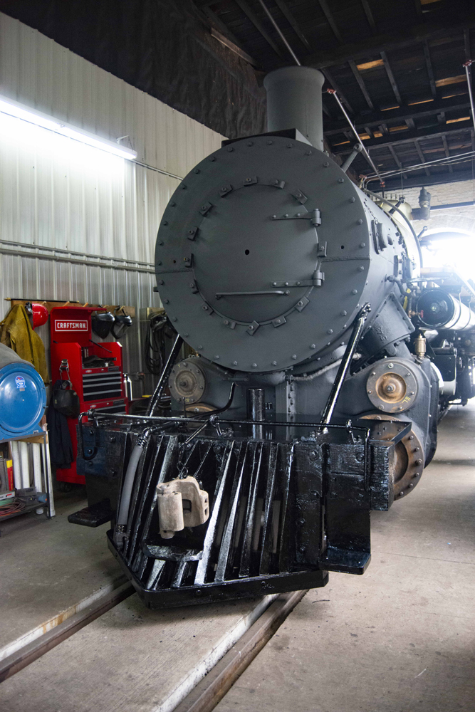 Front of steam locomotive missing, with headline and number plate removed