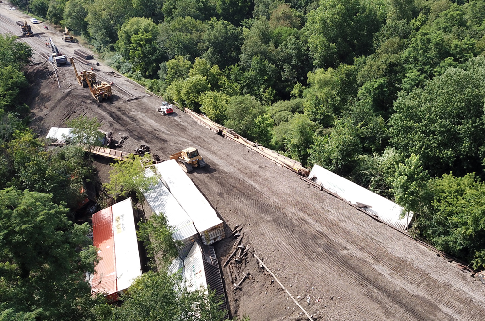 Heavy machinery working to rebuild track at site of derailment