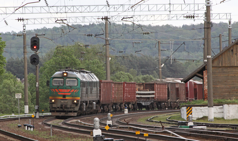 European freight train with diesel locomotives operates under catenary