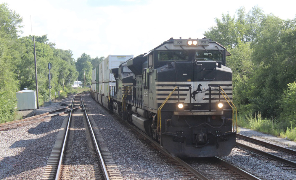 Freight train overtakes passenger train 