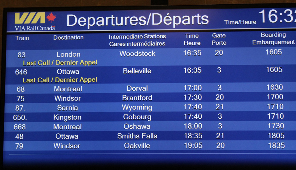 Electronic board listing nine passenger train departures