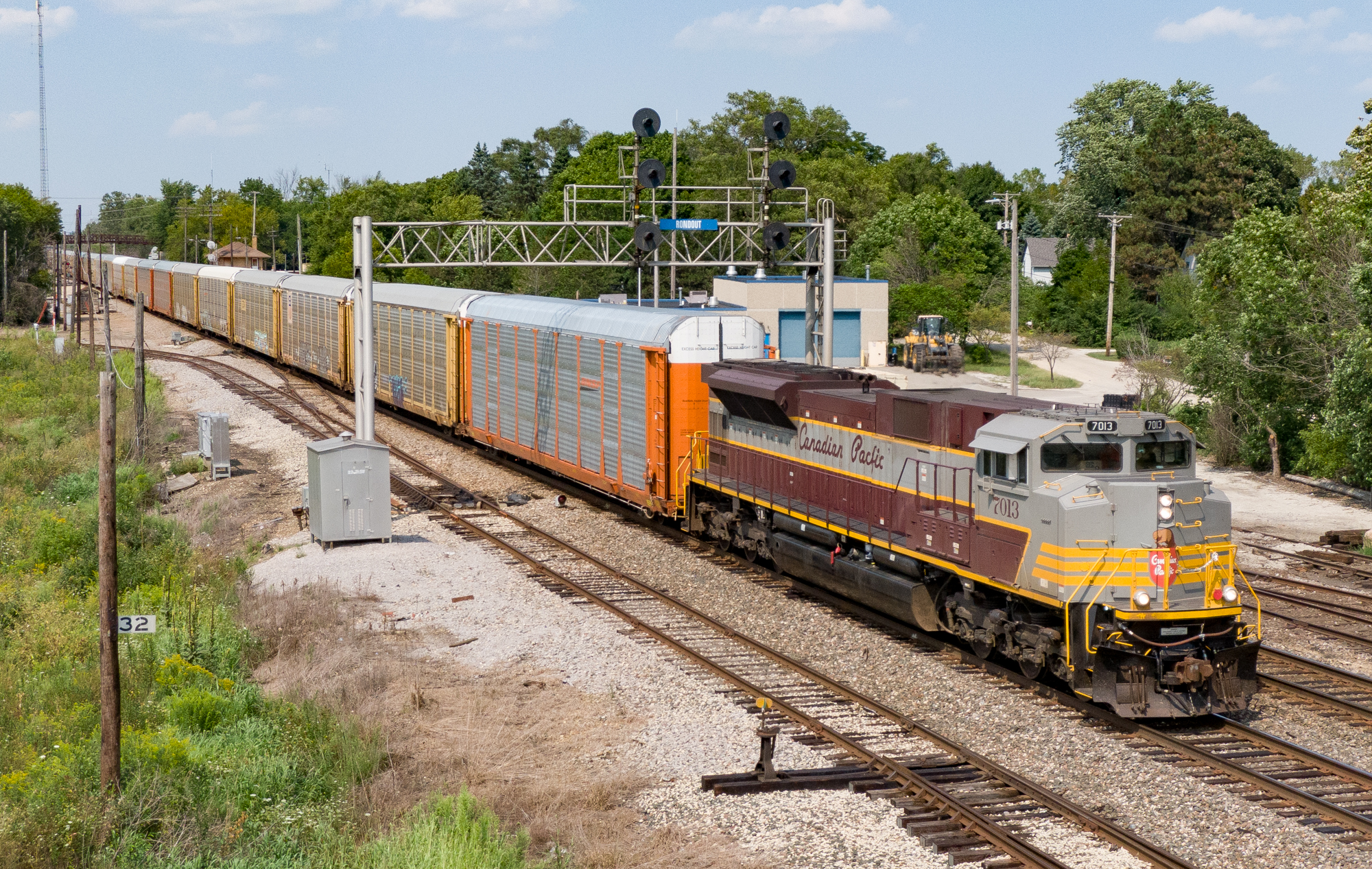 silver, orange and yellow locomotive