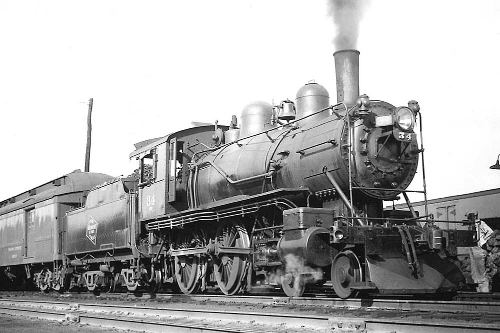 Steam locomotive with passenger train at station