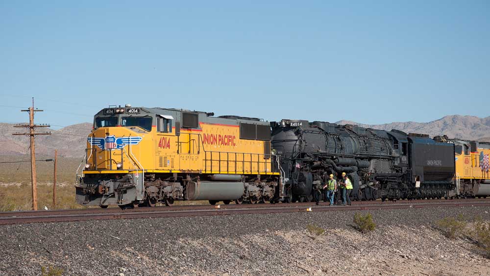 Union Pacific Armour yellow locomotive with steam locomotive