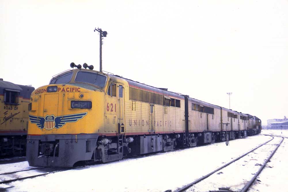 Union Pacific Armour yellow locomotive parked in snow