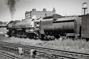 Rear three-quarter view of steam locomotive with rounded tender