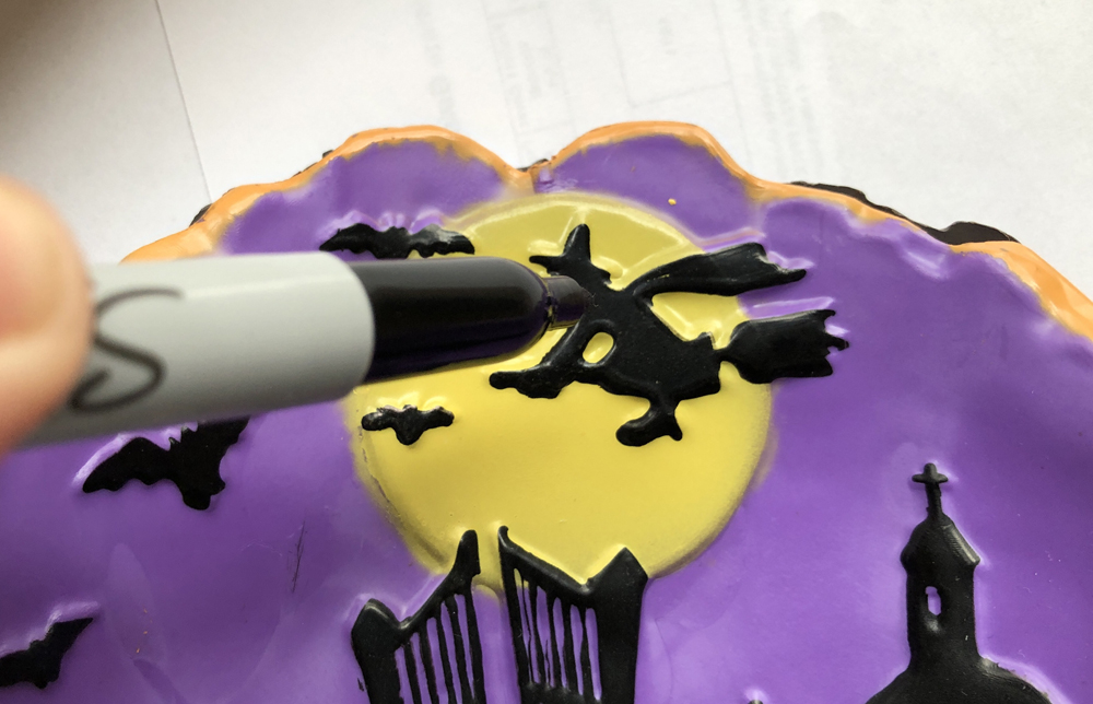 hand using marker to color on background