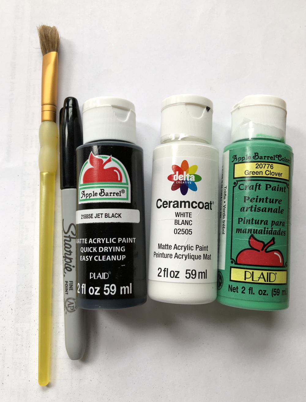 paint brush, marker, acrylic paints