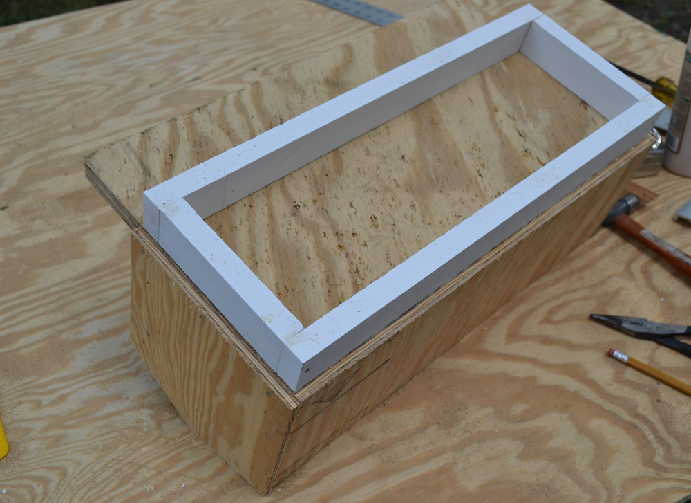 underside of wood structure with a plastic base
