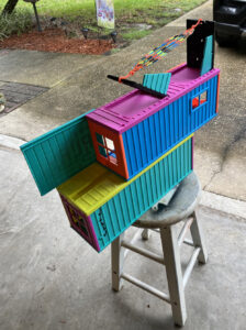 toy shipping container on a stool