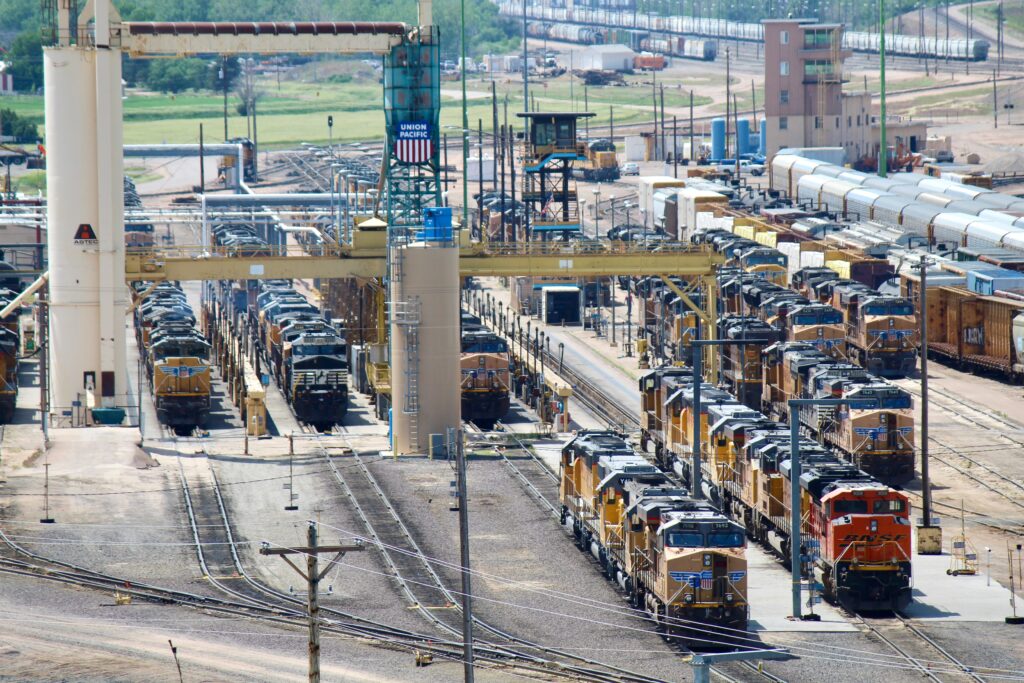 Numerous yellow locomotives parked in service area. Union Pacific CEO Jim Vena asks FRA for rolling stock inspection data.