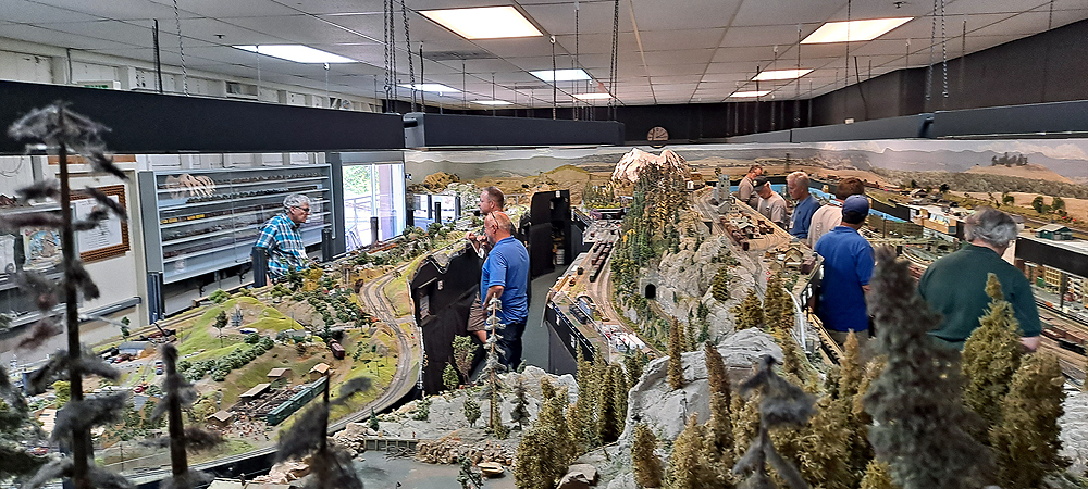 Overview of room-filling train layout about 50 feet deep
