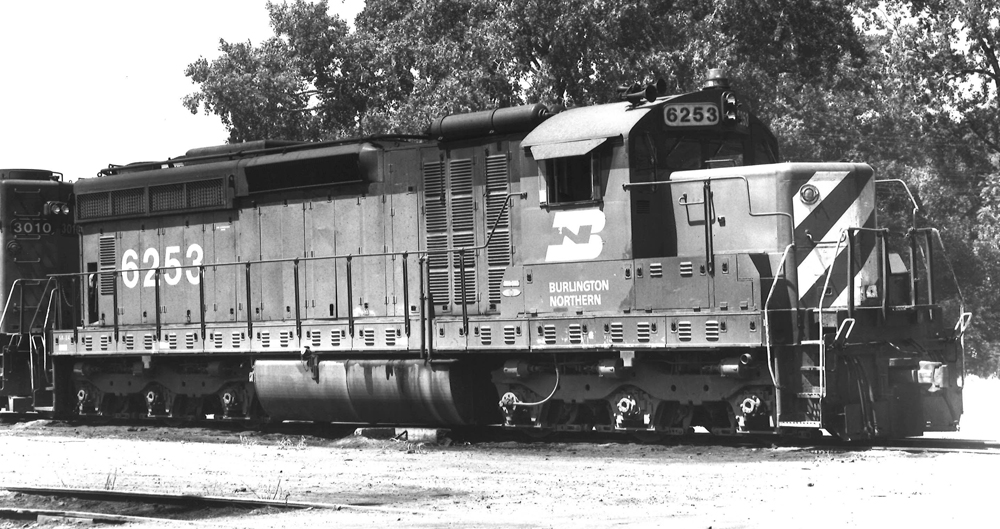 Black-and-white photo of six-axle road locomotive