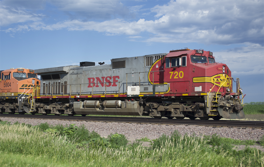 Photo of six-axle road locomotive on sunny day