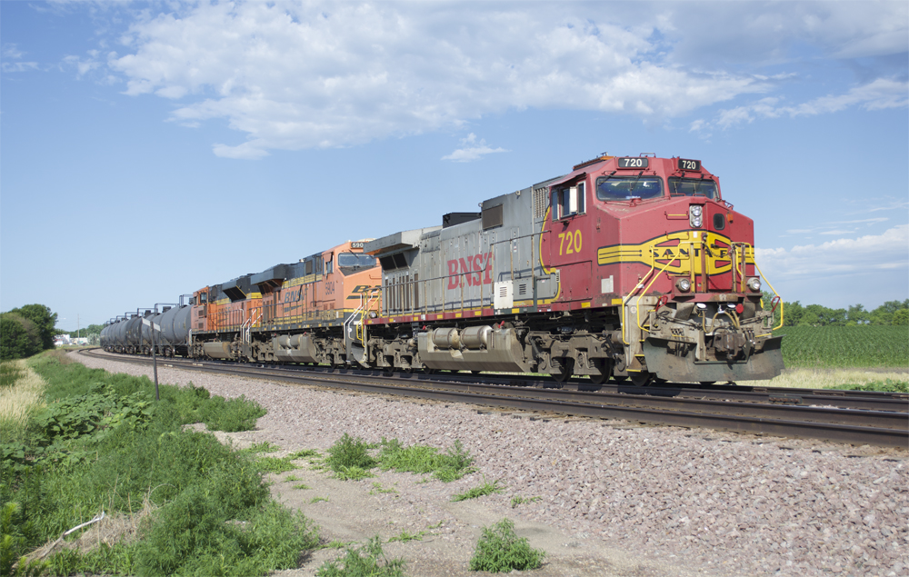 Photo of three road locomotives with unit tank train