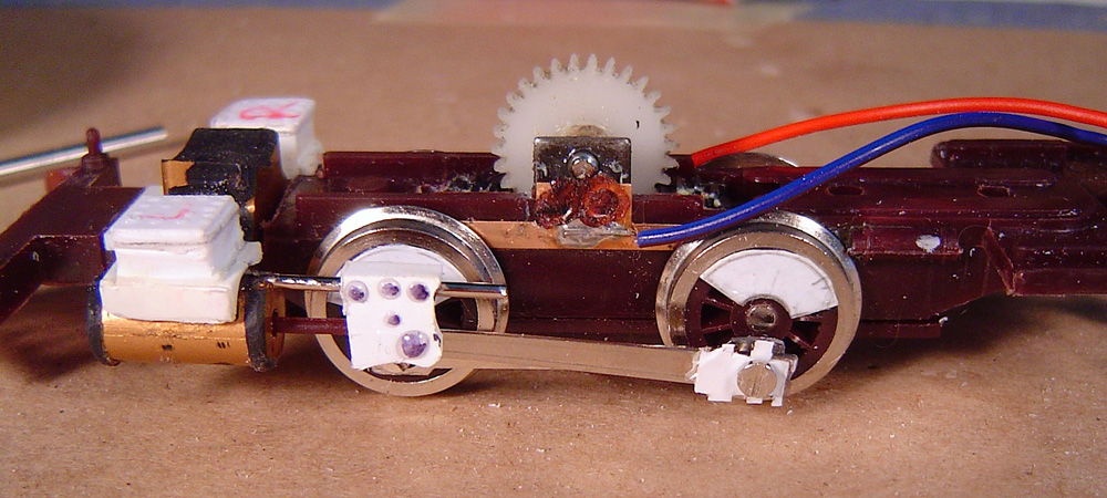 Side view of a model locomotive chassis with white styrene modifications