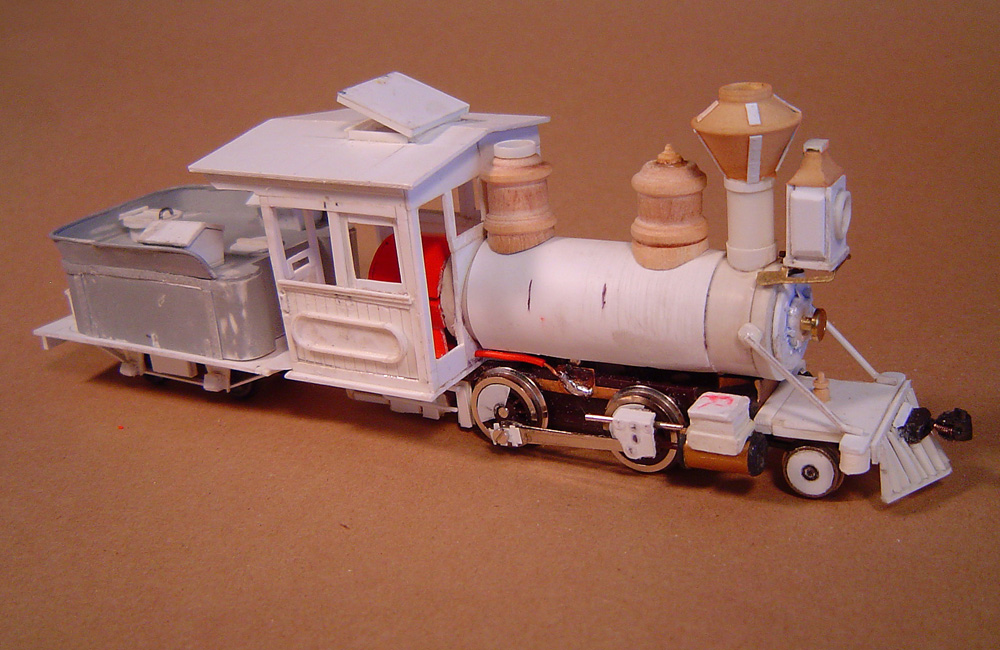 The nearly complete locomotive is seen, with scratchbuilt tender and domes turned from wood
