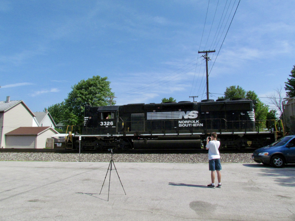 Boy watches train