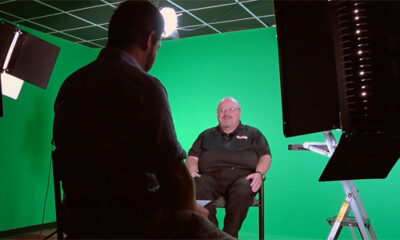 Two men in an elaborate video studio set.