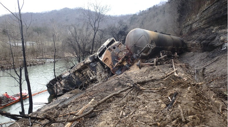 Ground level view of cars and locomotives destroyed by fire