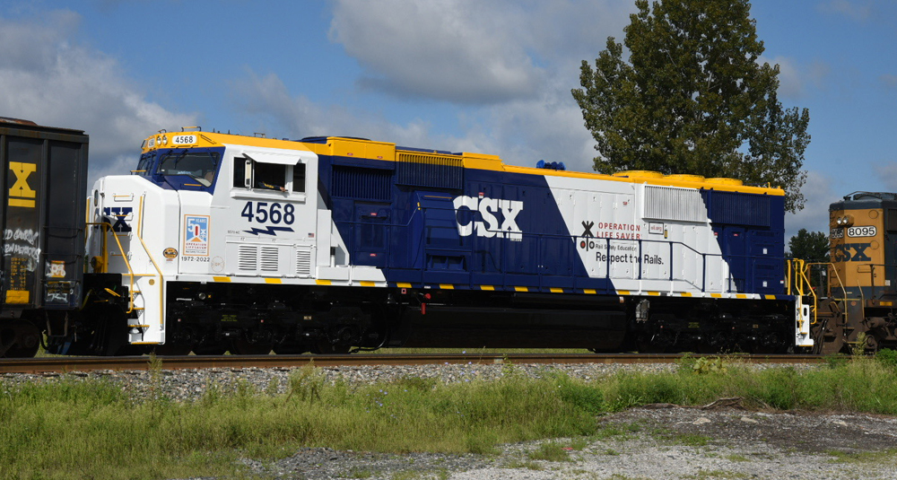 Blue and white locomotive with gold roof