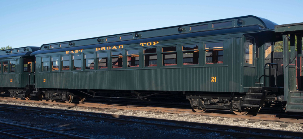 Dark green passenger car with gold lettering