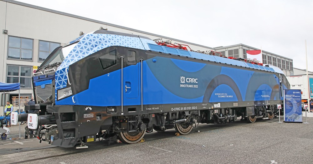 Large blue electric locomotive on display track
