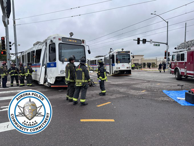 Damaged light-rail train in roadway